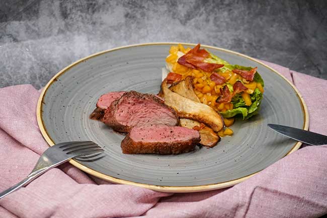Private Chef Tenerife - Gourmet Filet Mignon with Roasted Mushrooms and Bacon Perfectly cooked filet mignon served with crispy bacon, sautéed corn, and roasted king oyster mushrooms, prepared by your private chef in Tenerife.